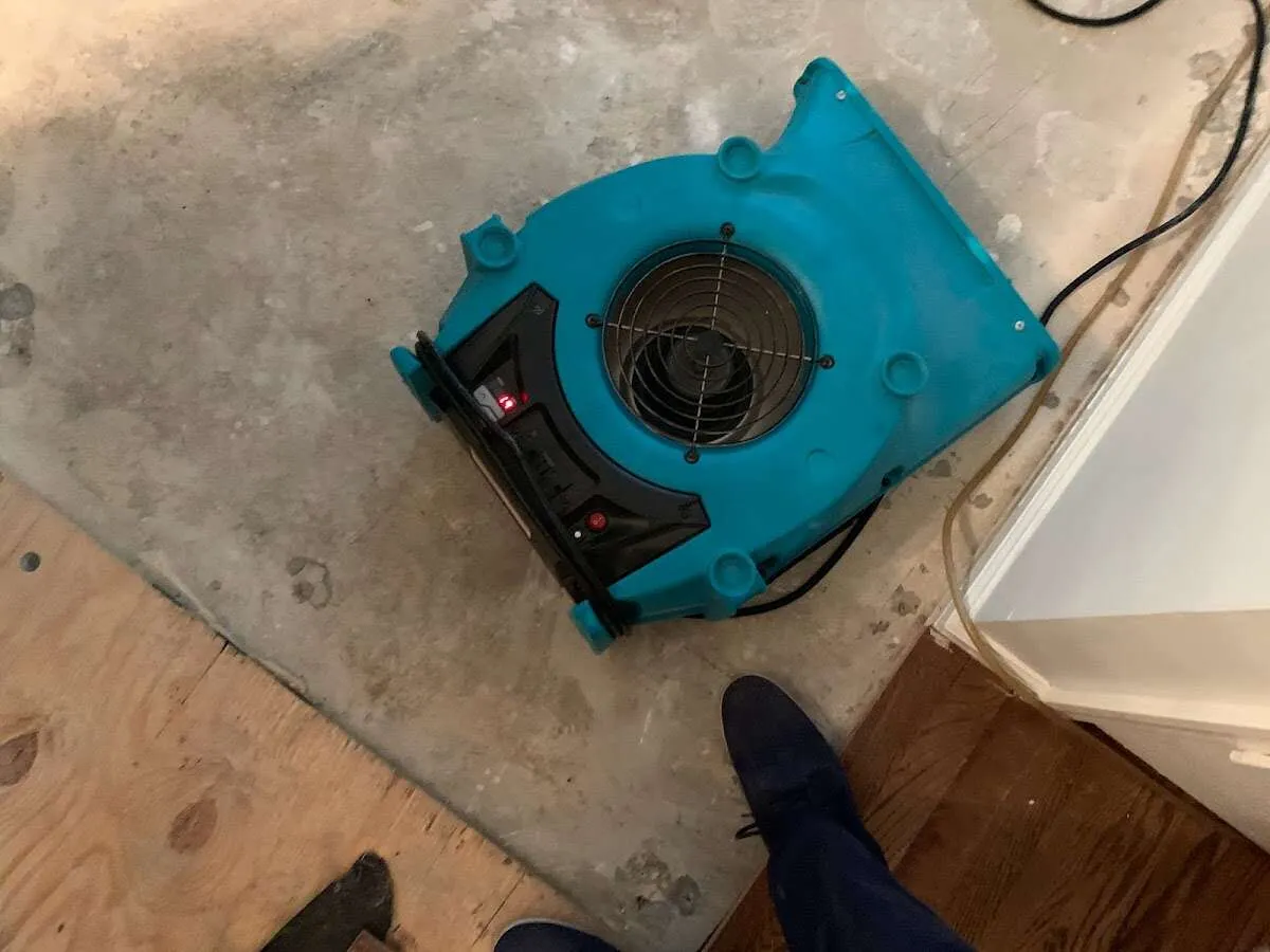 Air mover drying subfloor during Leak Detection & Repair in Chesterland